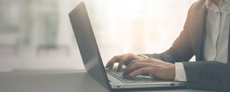 Employee typing on a computer