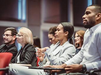 faculty looking forward during presentation